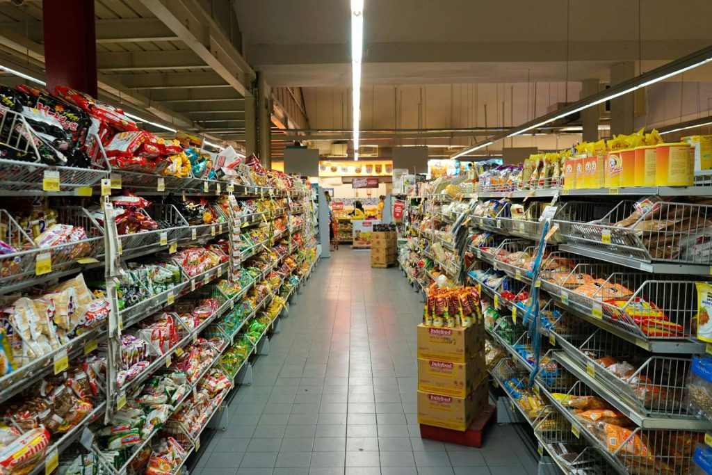 Supermarket aisle filled with snacks